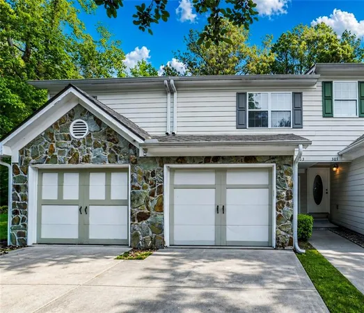 a front view of a house with a garage