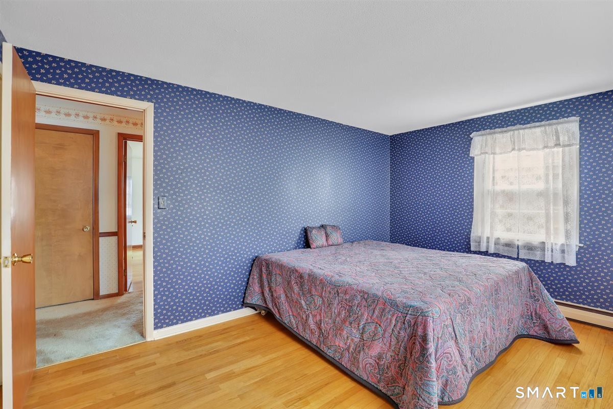 282 Parker Avenue Meriden, CT 06450 - Photo 13 of 27 a bedroom with a bed and a window