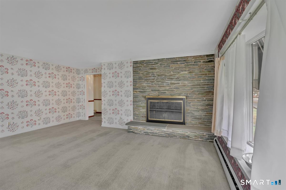 282 Parker Avenue Meriden, CT 06450 - Photo 5 of 27 an empty room with a fireplace