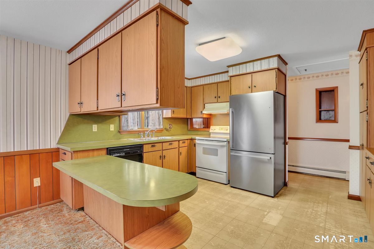 282 Parker Avenue Meriden, CT 06450 - Photo 10 of 27 a kitchen with refrigerator and cabinets