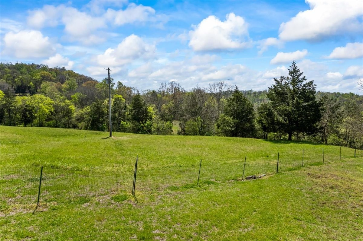 216 Old Wolf Hill Road Bethpage, TN 37022 - Photo 64 of 70 a view of a golf course with a house
