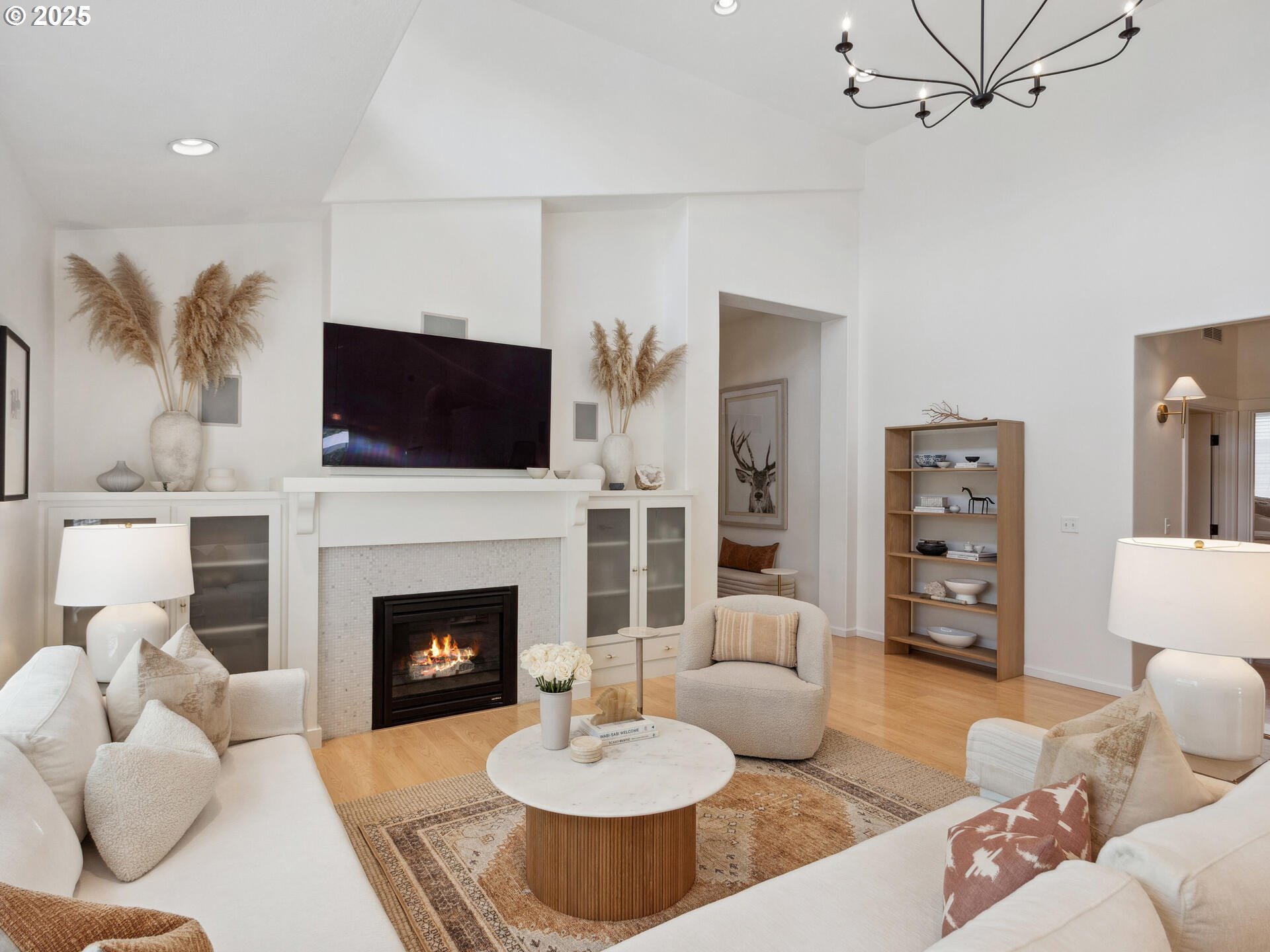 2318 South Sauk Way Ridgefield, WA 98642 - Photo 11 of 47 a living room with furniture a fireplace and a flat screen tv