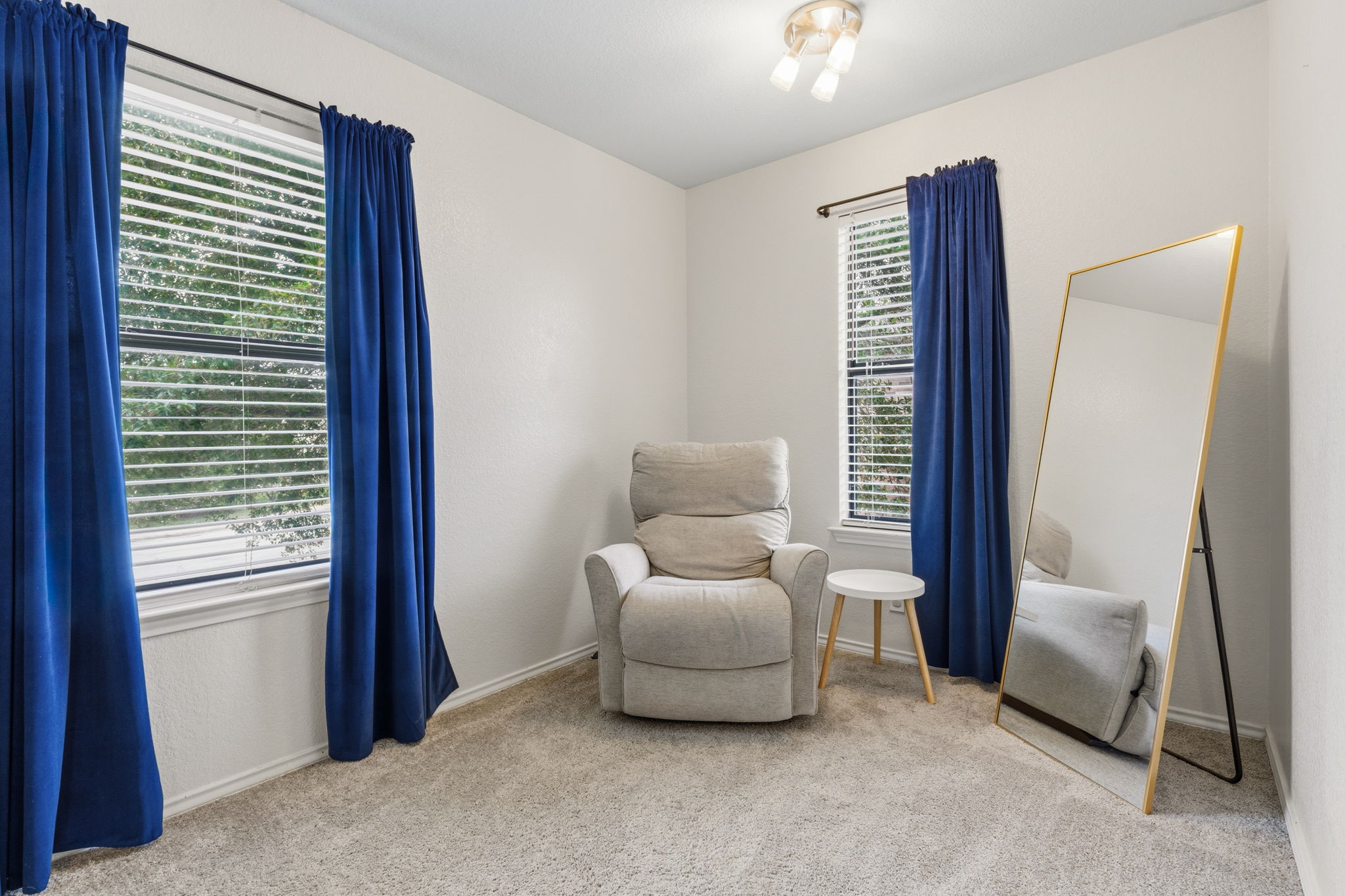 310 Myrtle Street Kyle, TX 78640 - Photo 19 of 39 a living room with furniture and a window