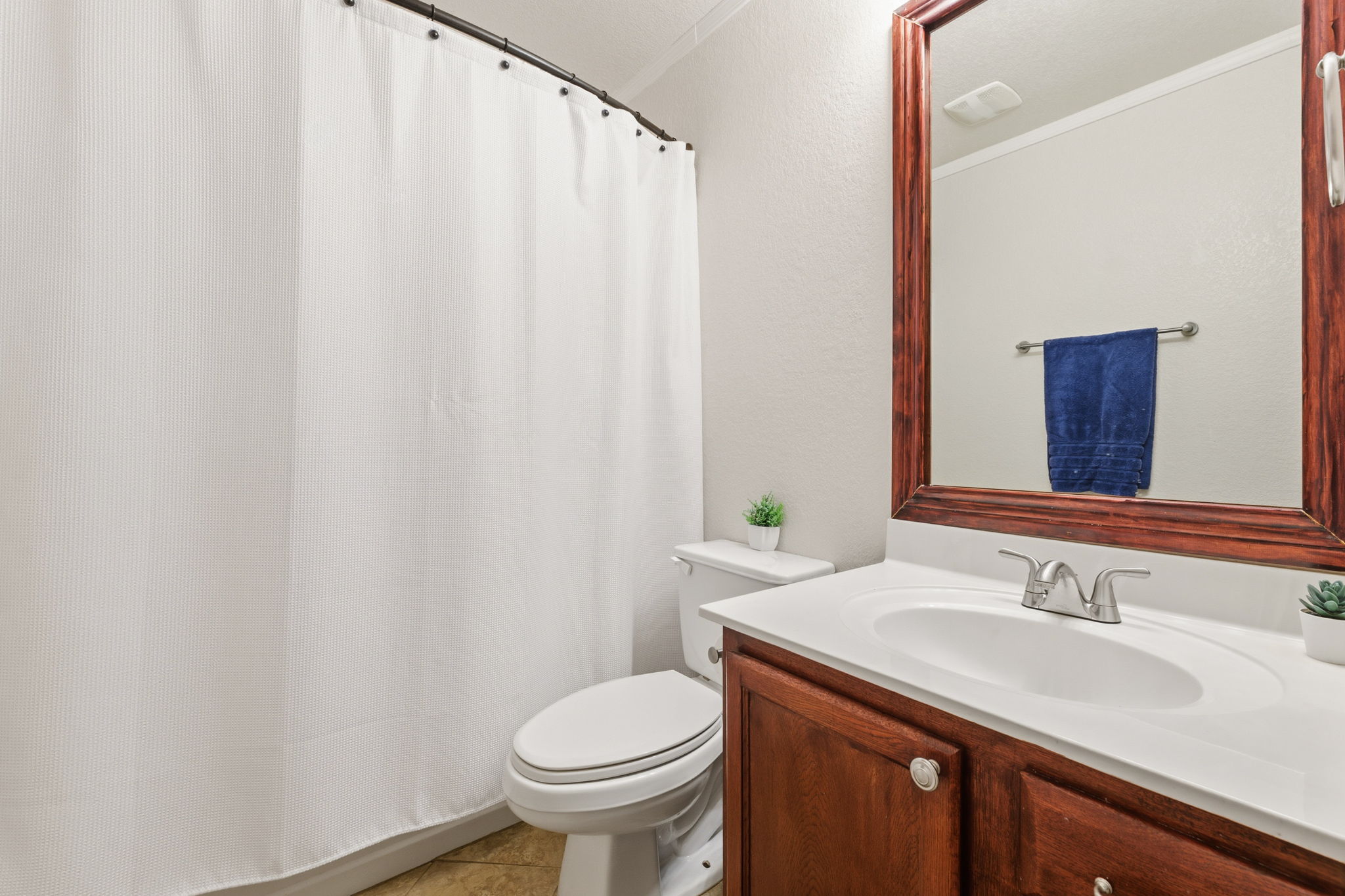 310 Myrtle Street Kyle, TX 78640 - Photo 22 of 39 a bathroom with a sink and toilet