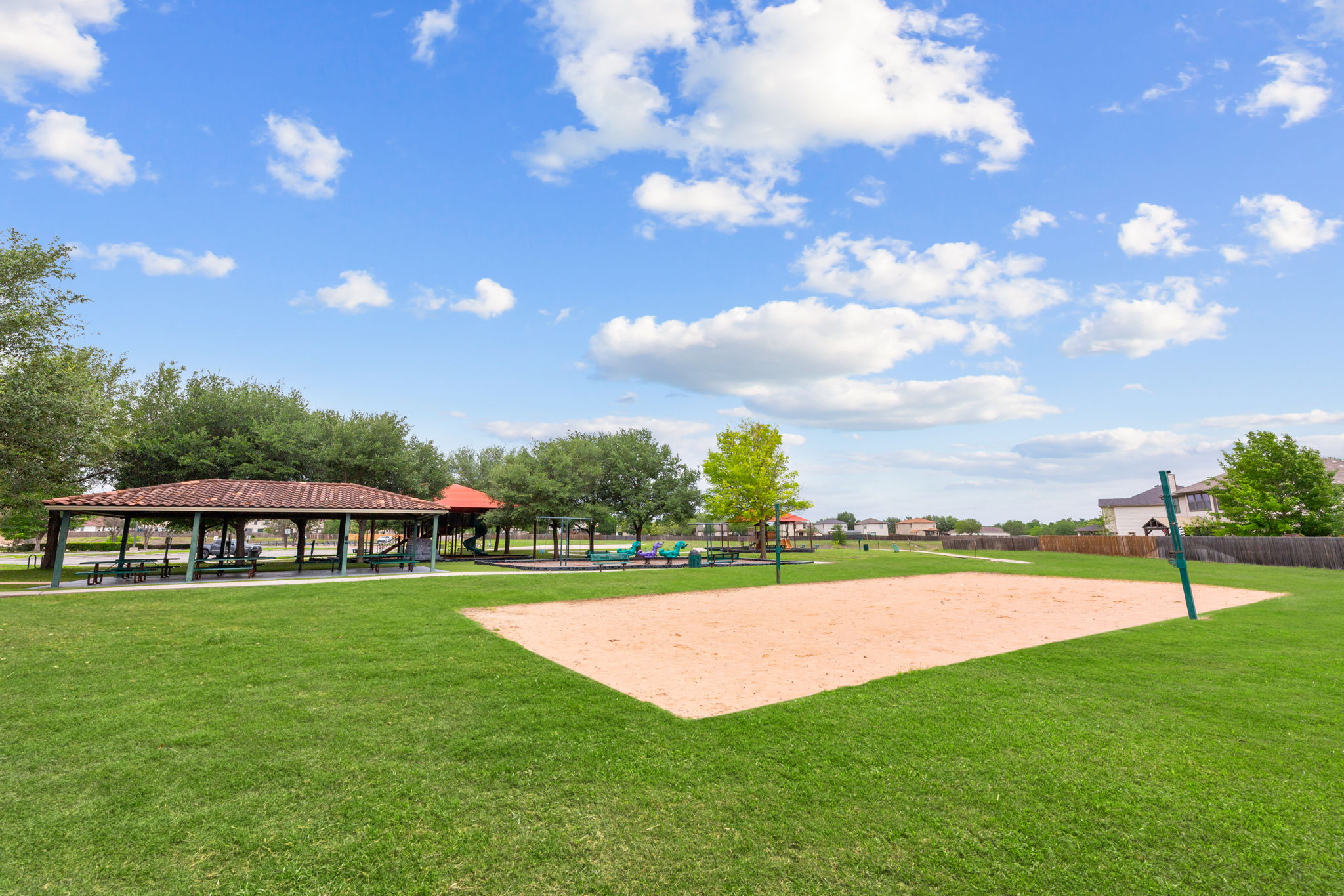 310 Myrtle Street Kyle, TX 78640 - Photo 38 of 39 a view of a swimming pool with lawn chairs and a big yard