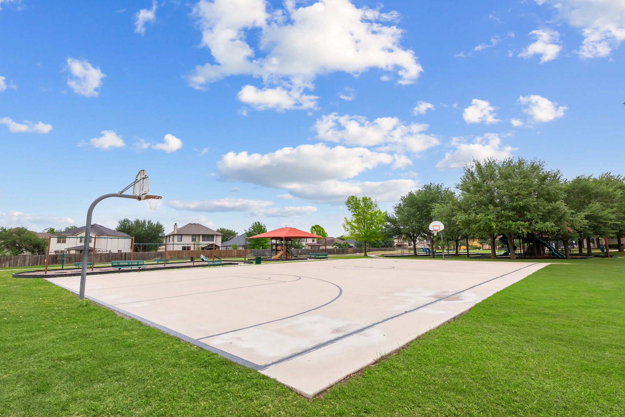 310 Myrtle Street Kyle, TX 78640 - Photo 39 of 39 Concrete basketball court surrounded by green lawn