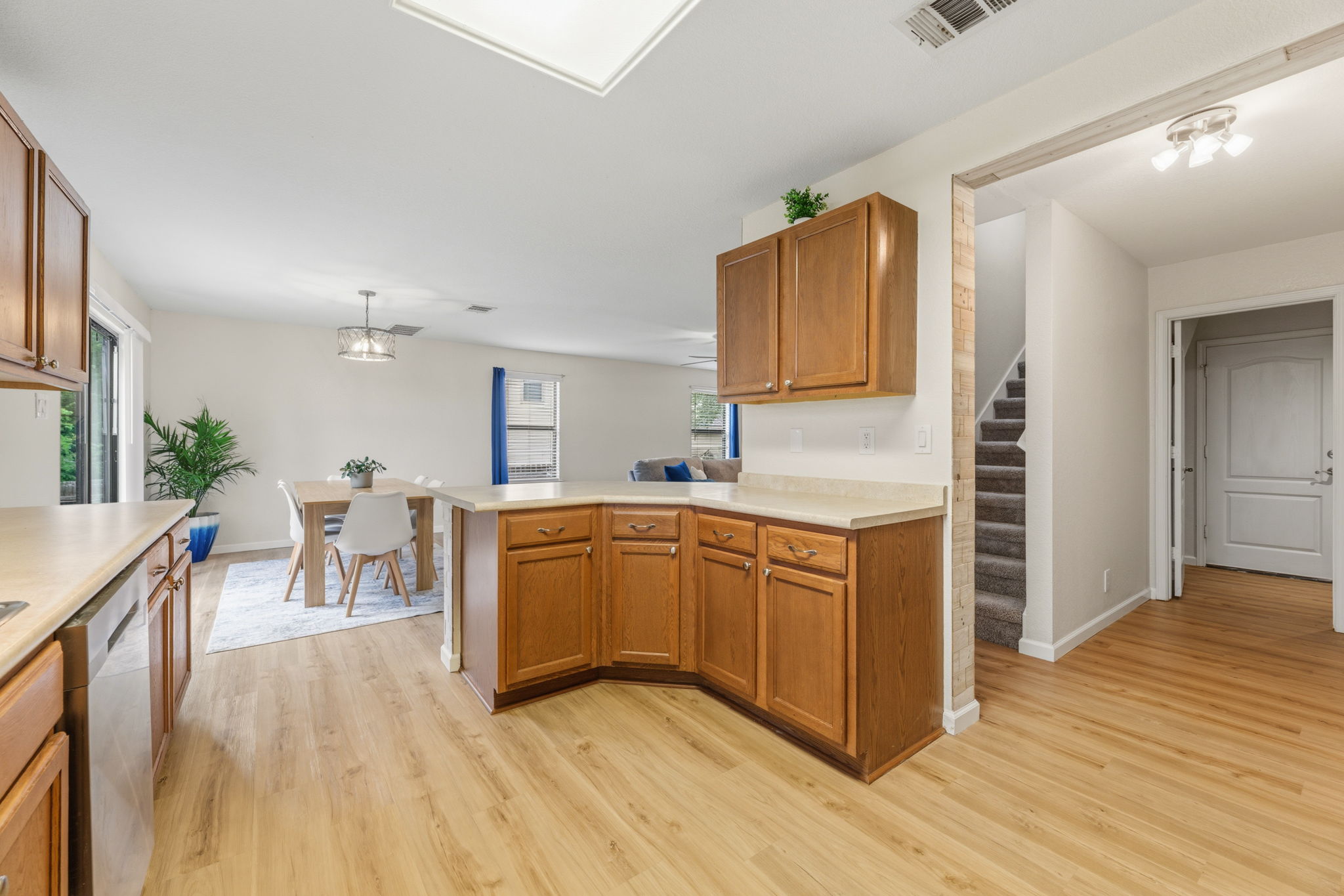 310 Myrtle Street Kyle, TX 78640 - Photo 8 of 39 a kitchen with stainless steel appliances granite countertop a stove top oven a sink dishwasher and cabinets with wooden floor
