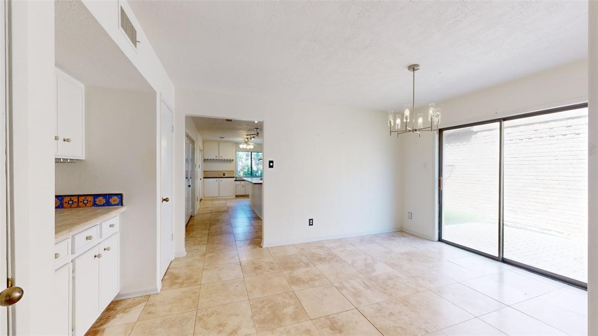 3004 Gleneagles Court Bryan, TX 77802 - Photo 5 of 38 a view of a kitchen with furniture and wooden floor