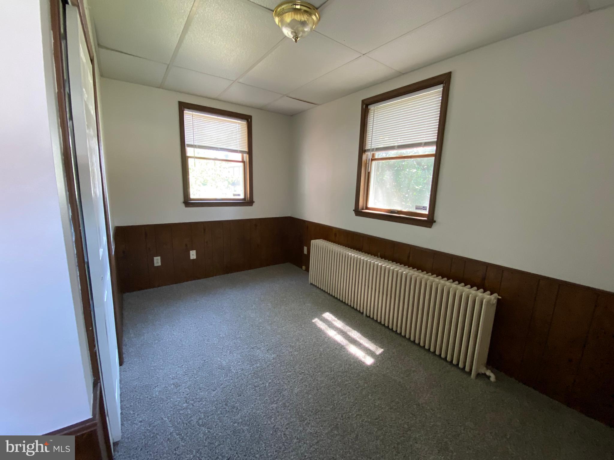 9532 Belair Road Baltimore, MD 21236 - Photo 12 of 20 a view of an empty room with a window