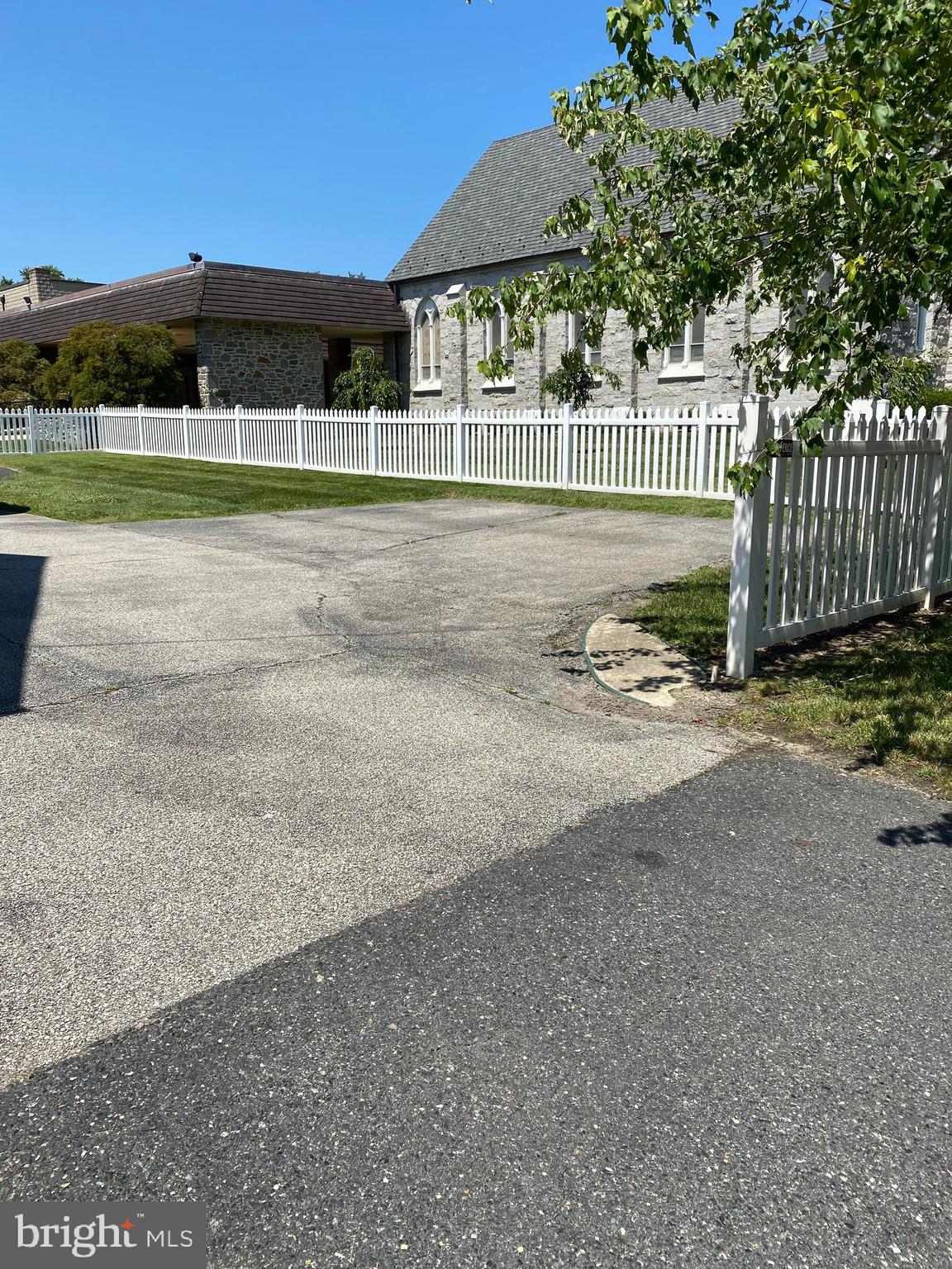 9532 Belair Road Baltimore, MD 21236 - Photo 4 of 20 a view of a house with a yard and a car garage