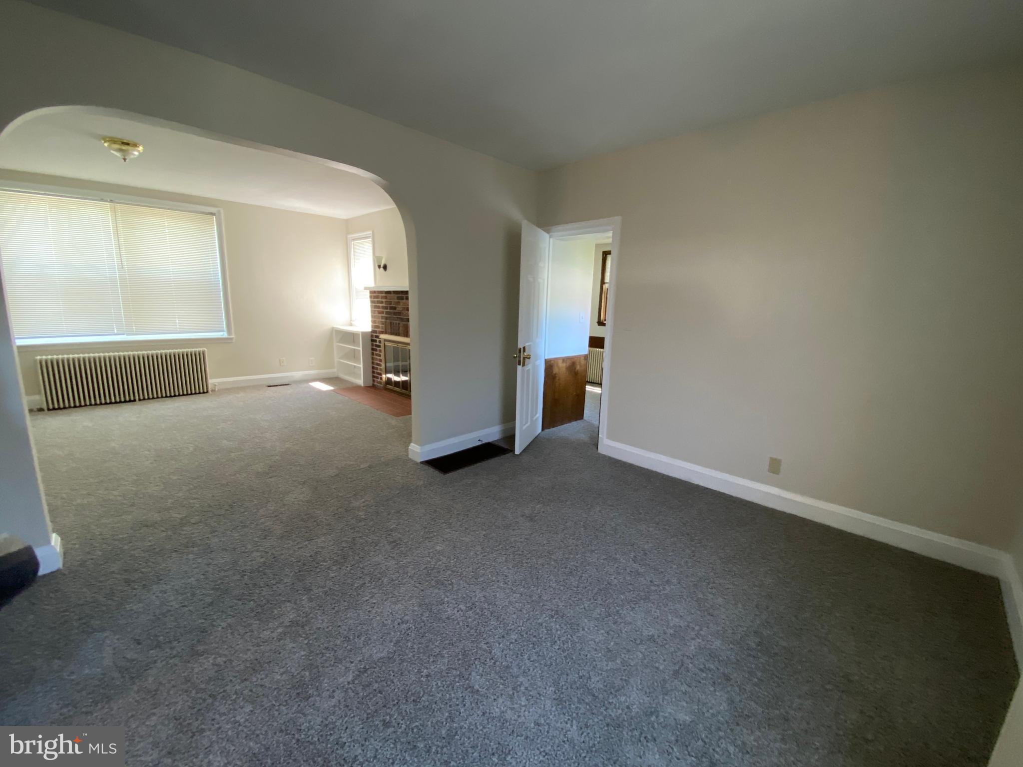 9532 Belair Road Baltimore, MD 21236 - Photo 8 of 20 a view of a big room with closet and windows