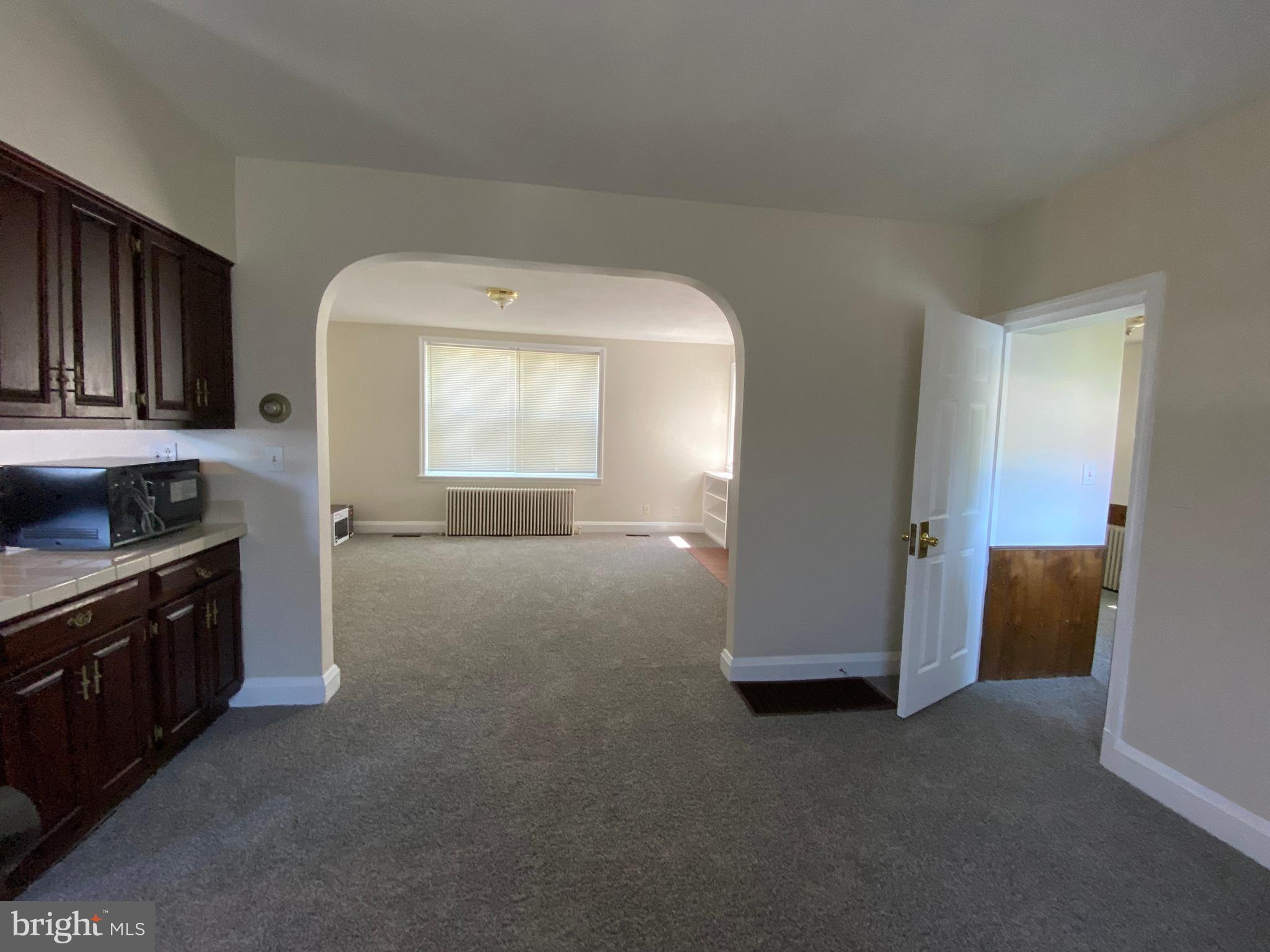 9532 Belair Road Baltimore, MD 21236 - Photo 9 of 20 a view of a kitchen with a sink cabinets and a window