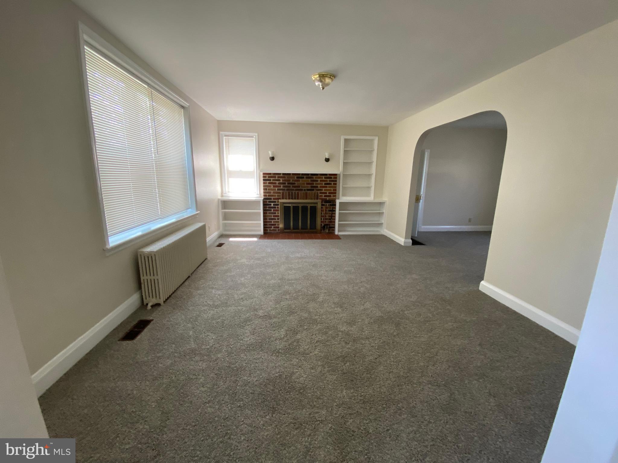 9532 Belair Road Baltimore, MD 21236 - Photo 10 of 20 a view of a livingroom with a fireplace