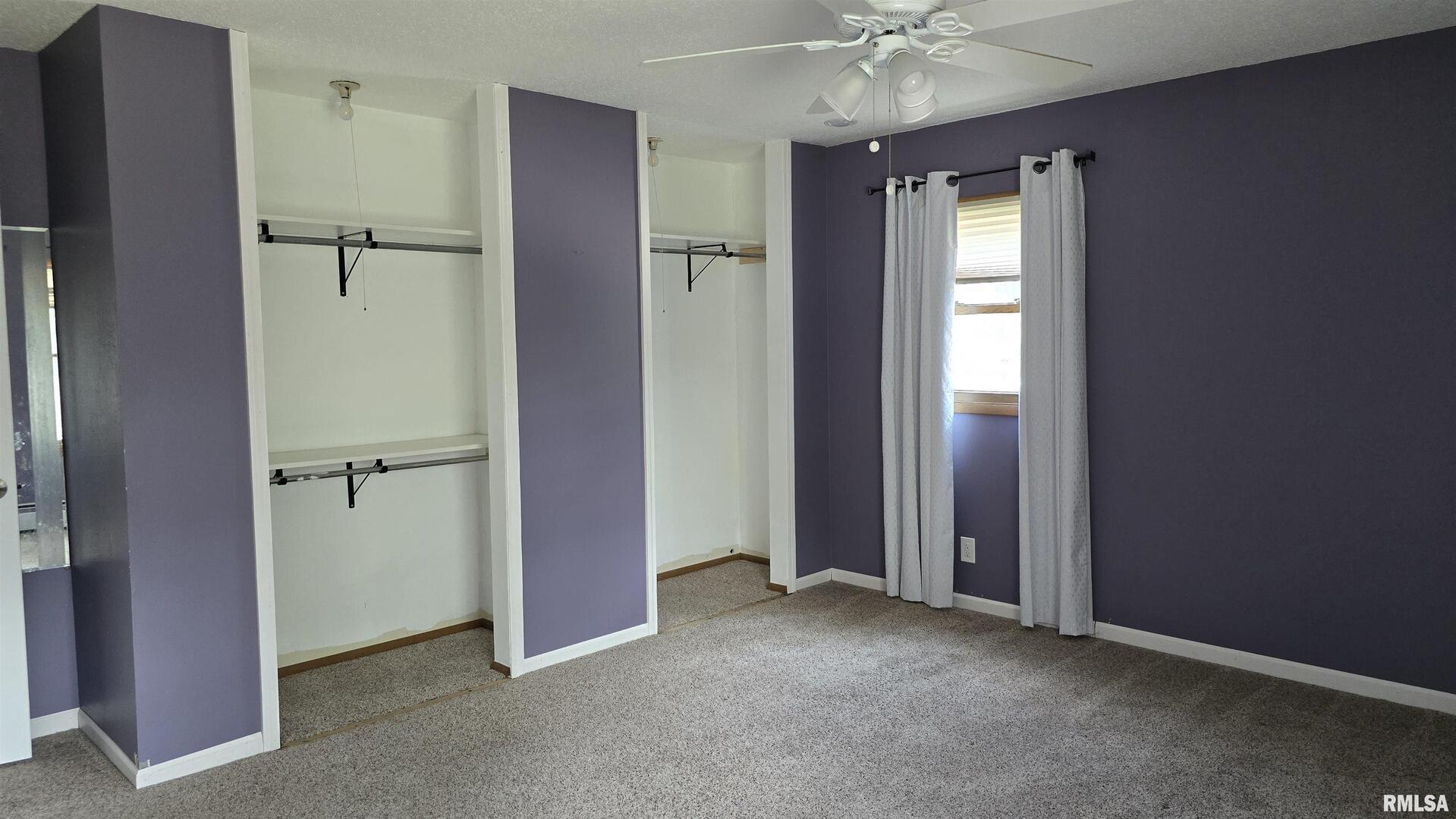 601 Scenic Drive Clinton, IA 52732 - Photo 7 of 16 an empty room and chandelier fan