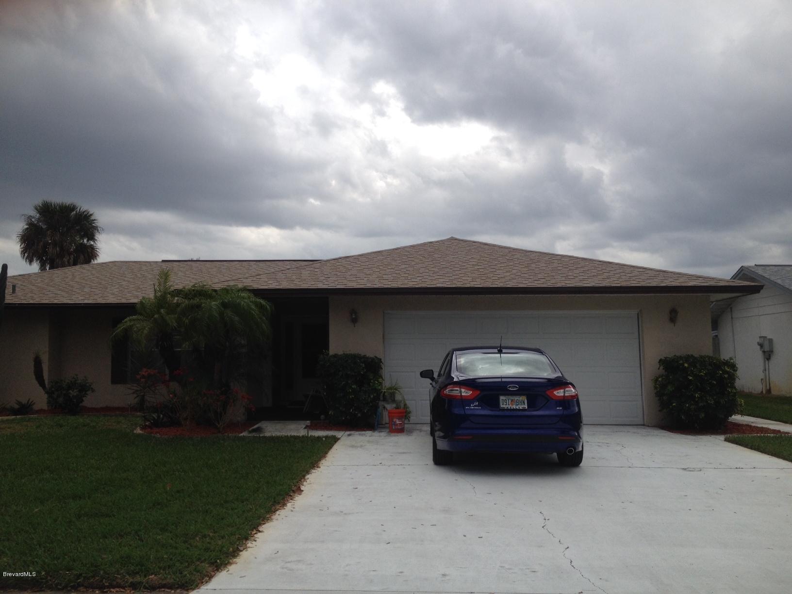 a car parked in front of a house