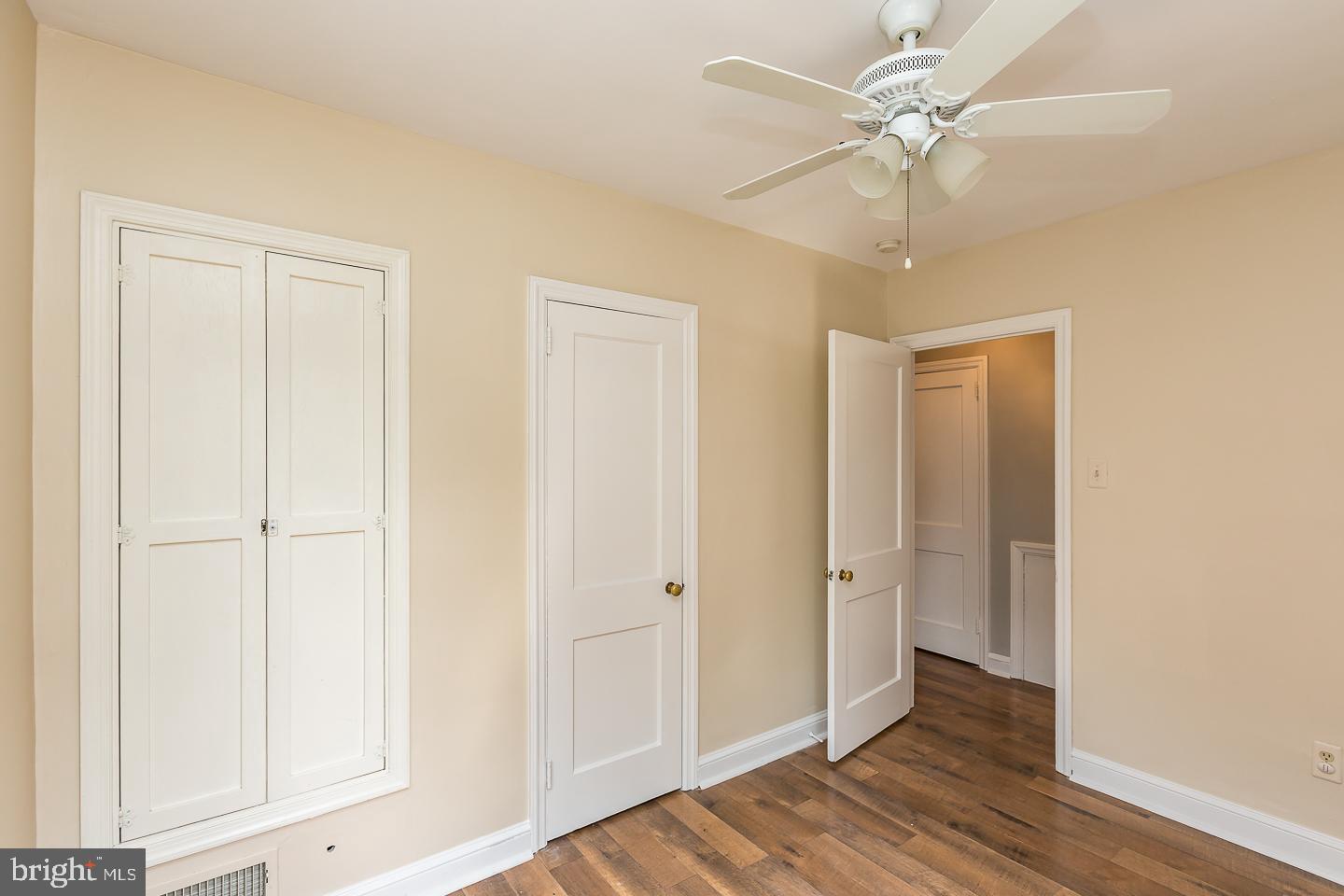 339 East Spring Avenue Ardmore, PA 19003 - Photo 35 of 44 an empty room with wooden floor closet fan and windows