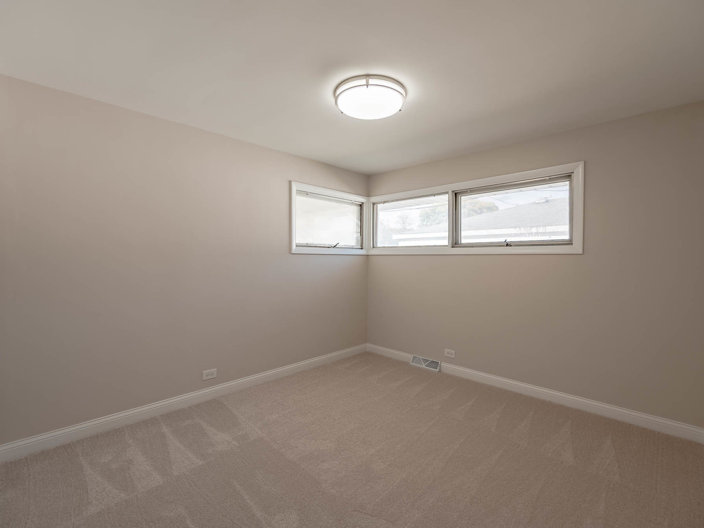 1502 35th Avenue Melrose Park, IL 60160 - Photo 7 of 11 an empty room with windows