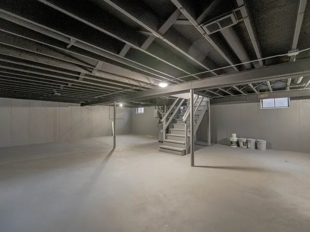 a view of empty room with wooden ceiling