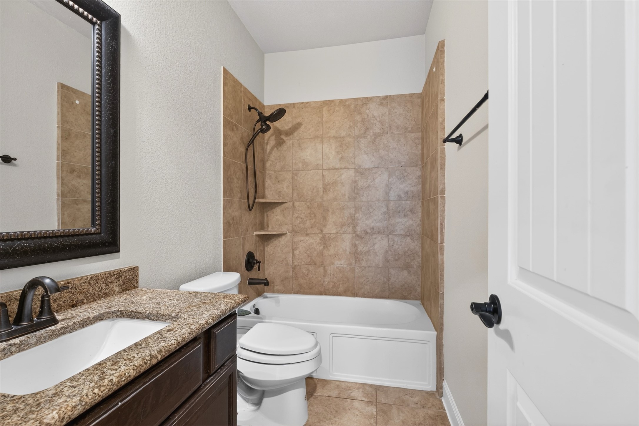 18202 Wedgewood Bluff Court Spring, TX 77379 - Photo 14 of 50 Convenient downstairs bath with neutral finishes and tub/shower combination.
