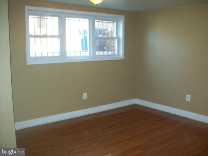 4732 Benning Road Southeast, Unit A101 Washington, DC 20019 - Photo 7 of 7 Living Room #2