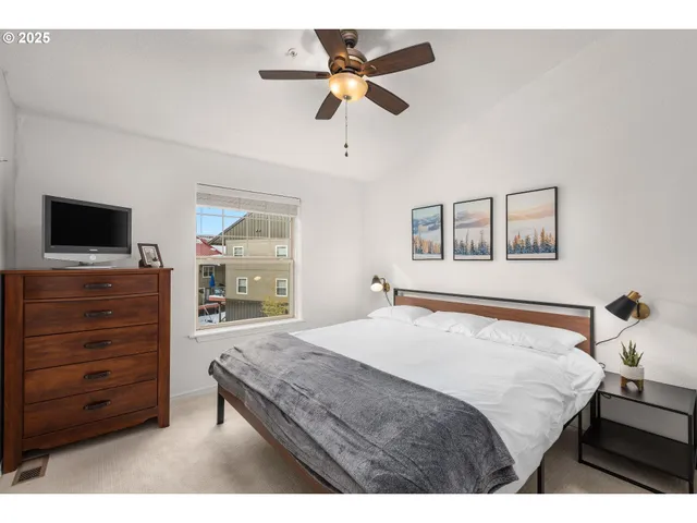 a bedroom with a bed and dresser