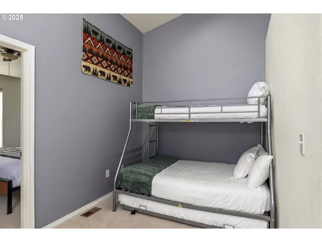 a bedroom with a bed and lamps