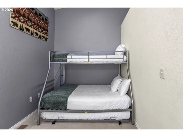 a bathroom with a sink a toilet a mirror and shower