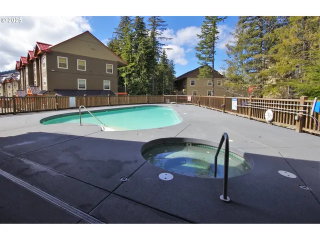 a view of a balcony with swimming pool