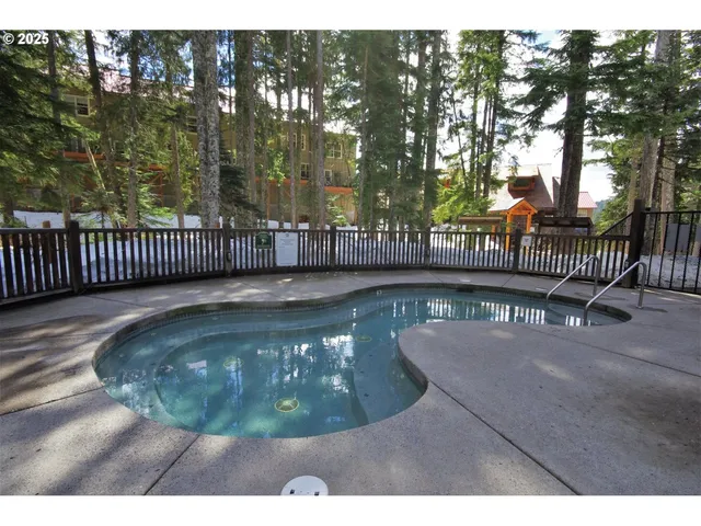 a view of a livingroom with furniture and a fireplace