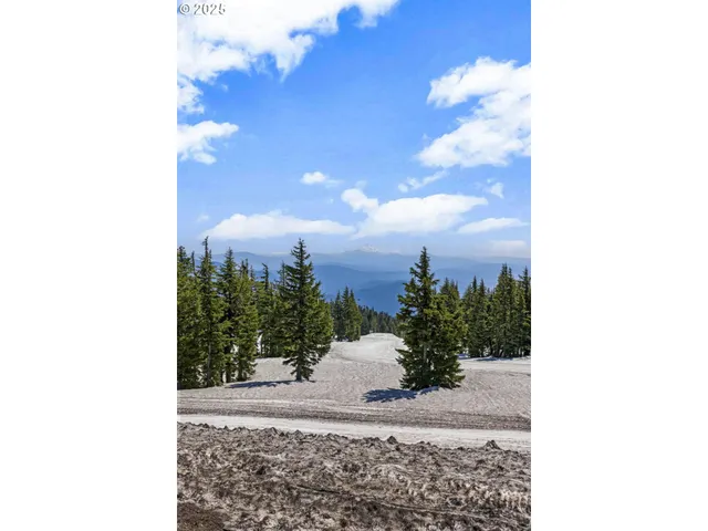 a view of multiple houses with a street