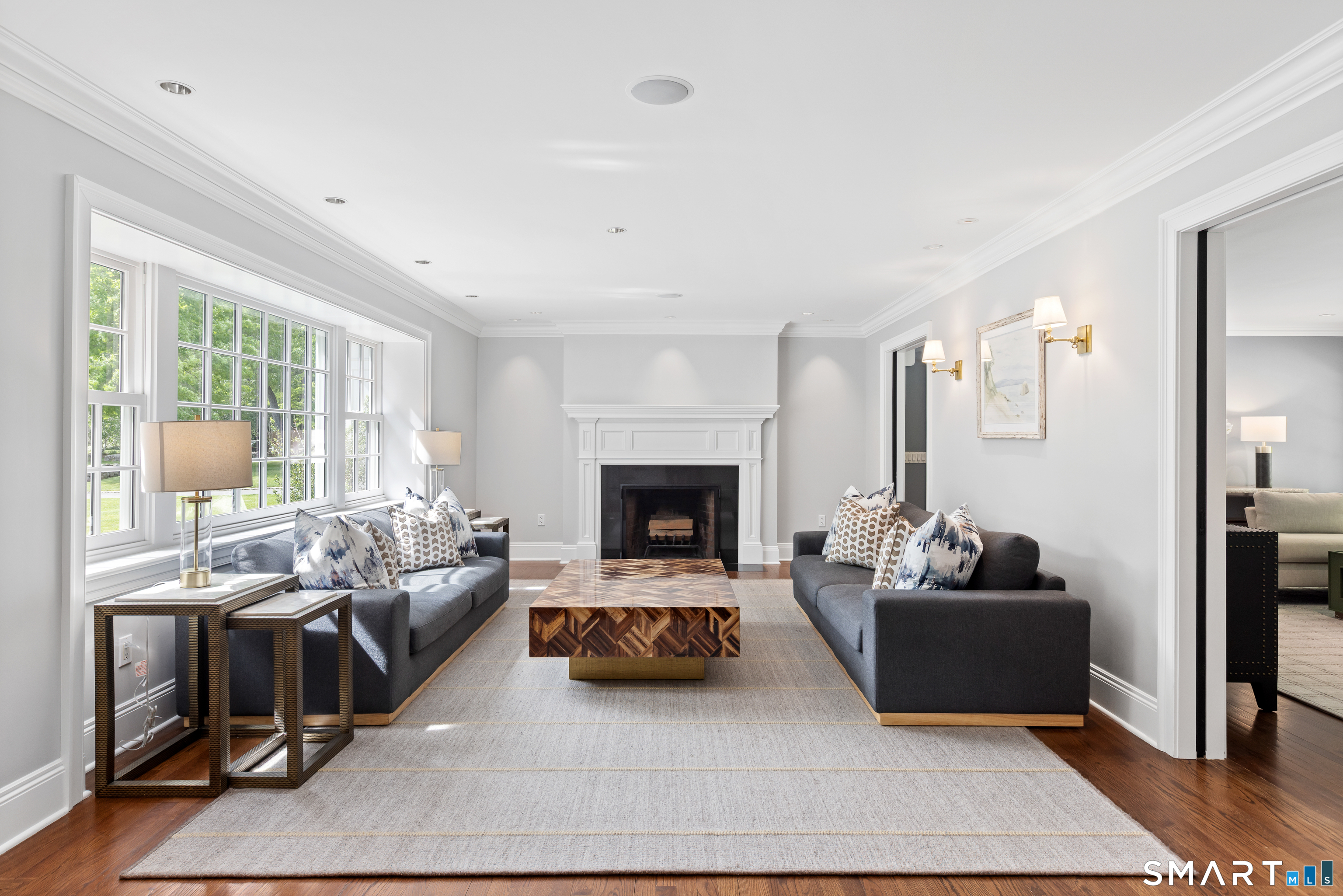 99 Hickok Road New Canaan, CT 06840 - Photo 4 of 39 a living room with furniture and a fireplace