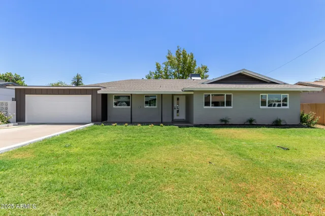front view of a house with a garden