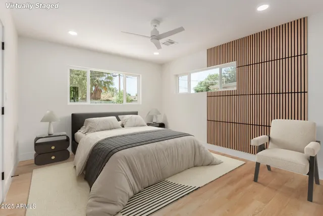 a bedroom with a bed and a couch