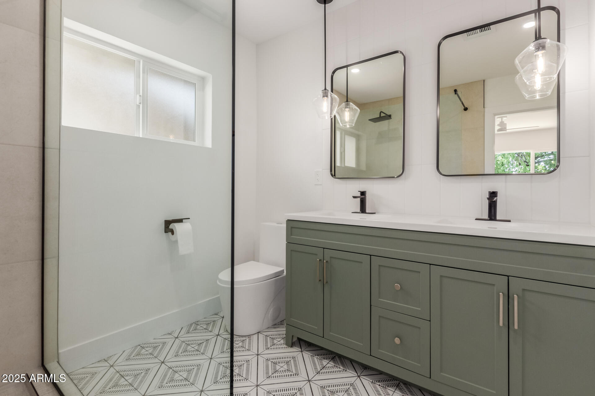 1311 East 2nd Place Mesa, AZ 85203 - Photo 14 of 29 a bathroom with a toilet sink and mirror