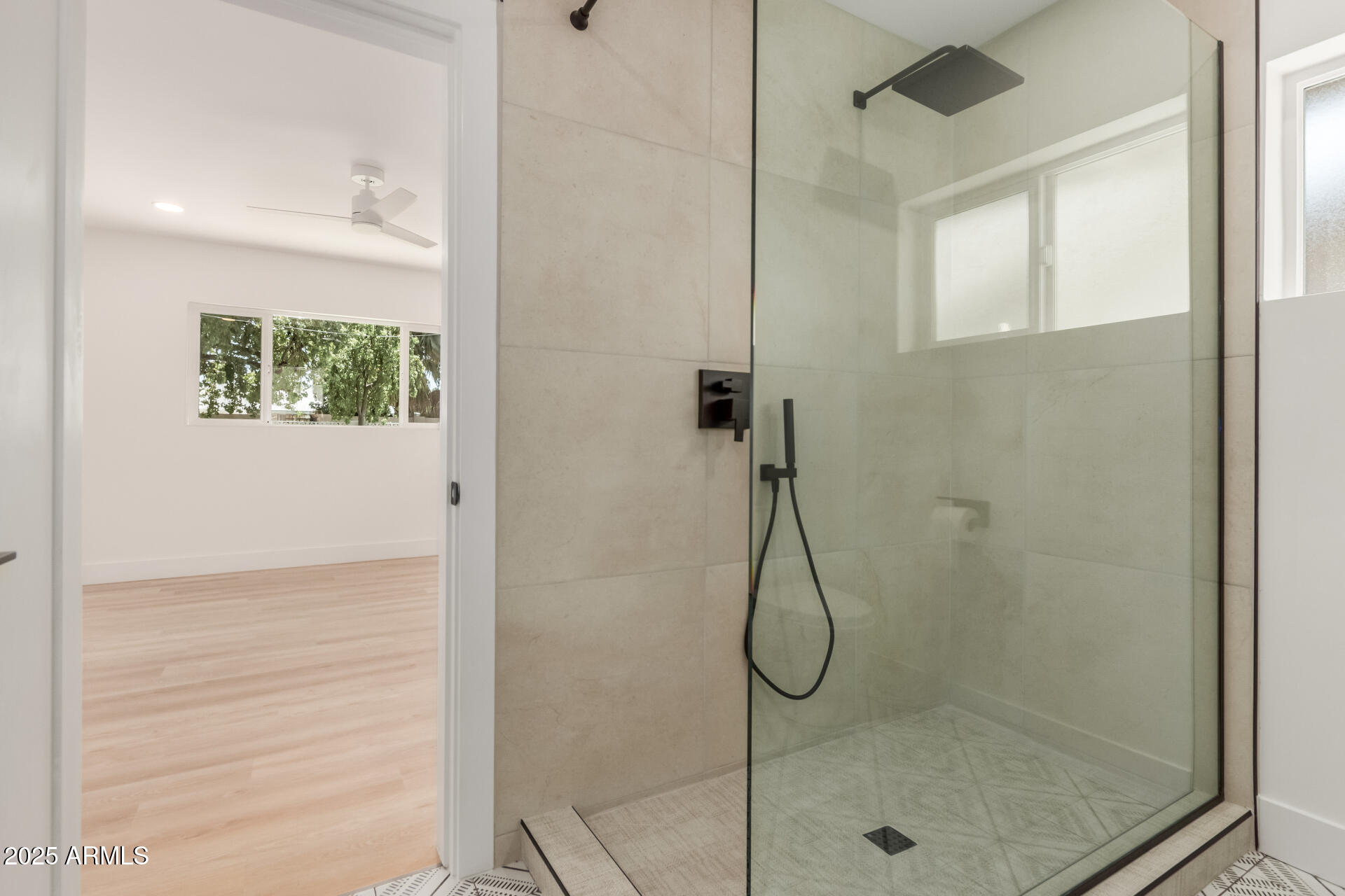 1311 East 2nd Place Mesa, AZ 85203 - Photo 15 of 29 a bathroom with a glass shower door