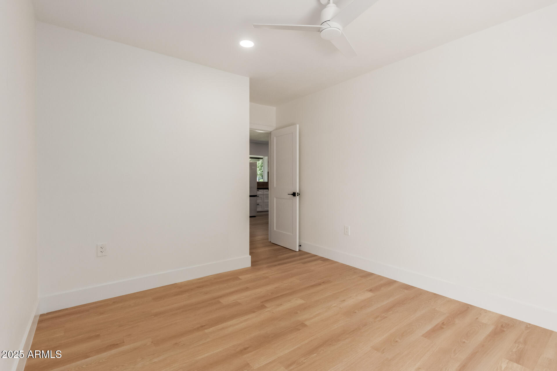 1311 East 2nd Place Mesa, AZ 85203 - Photo 22 of 29 an empty room with wooden floor