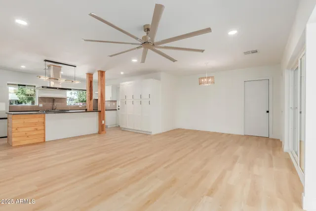a view of a kitchen with a dishwasher and a refrigerator