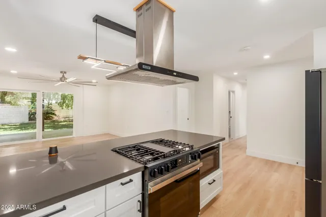 a kitchen with a stove and a sink