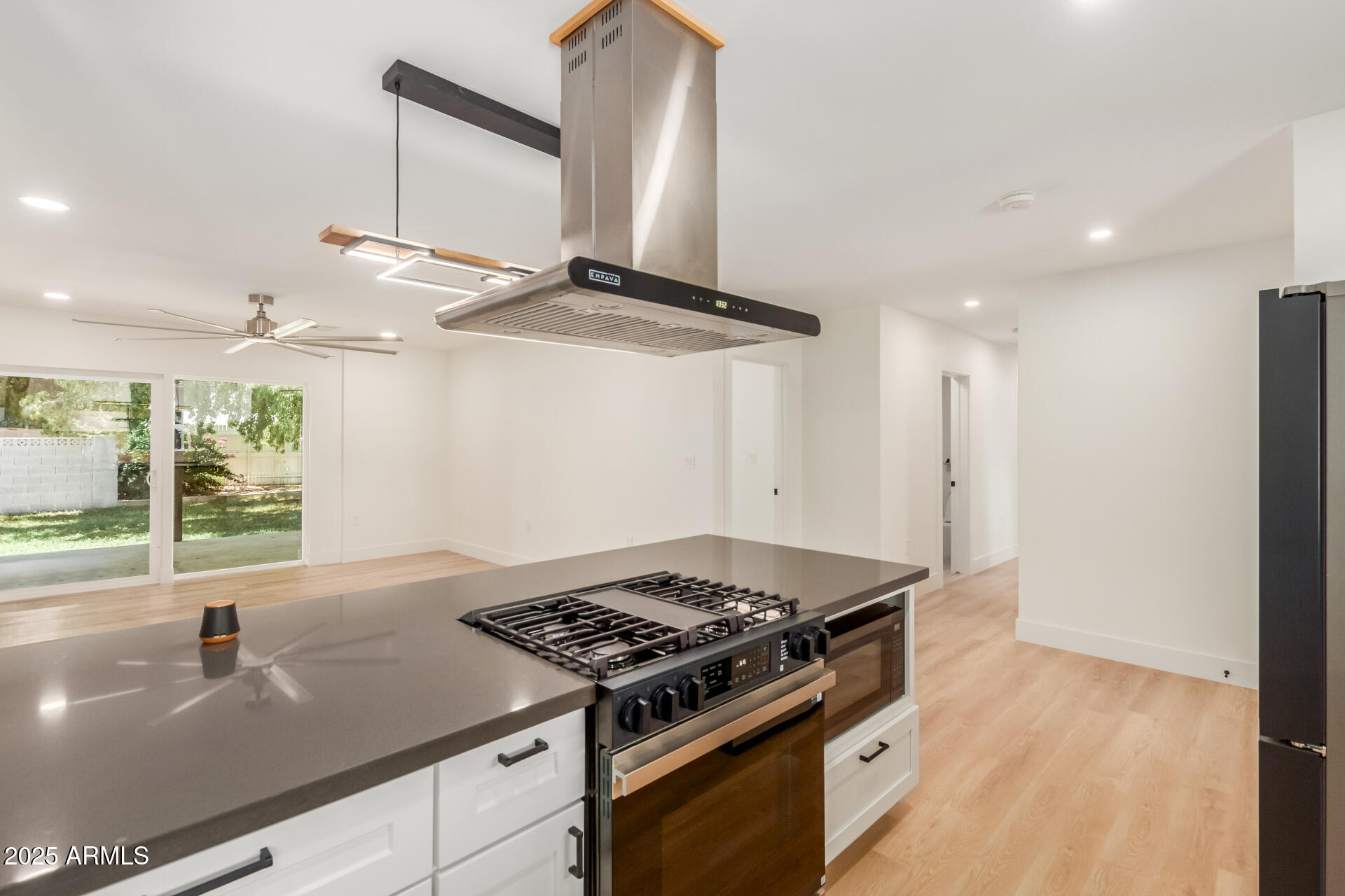 1311 East 2nd Place Mesa, AZ 85203 - Photo 10 of 29 a kitchen with a stove and a sink