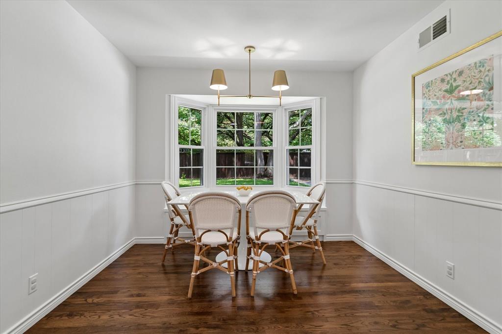 11439 Rosser Road Dallas, TX 75229 - Photo 15 of 35 a view of a dining room with furniture window and wooden floor
