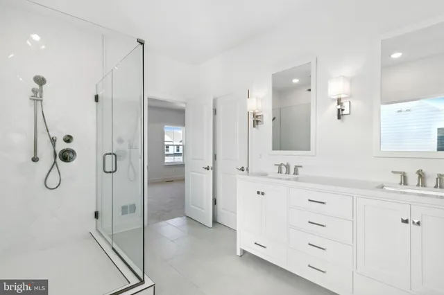 a bathroom with a shower and a sink