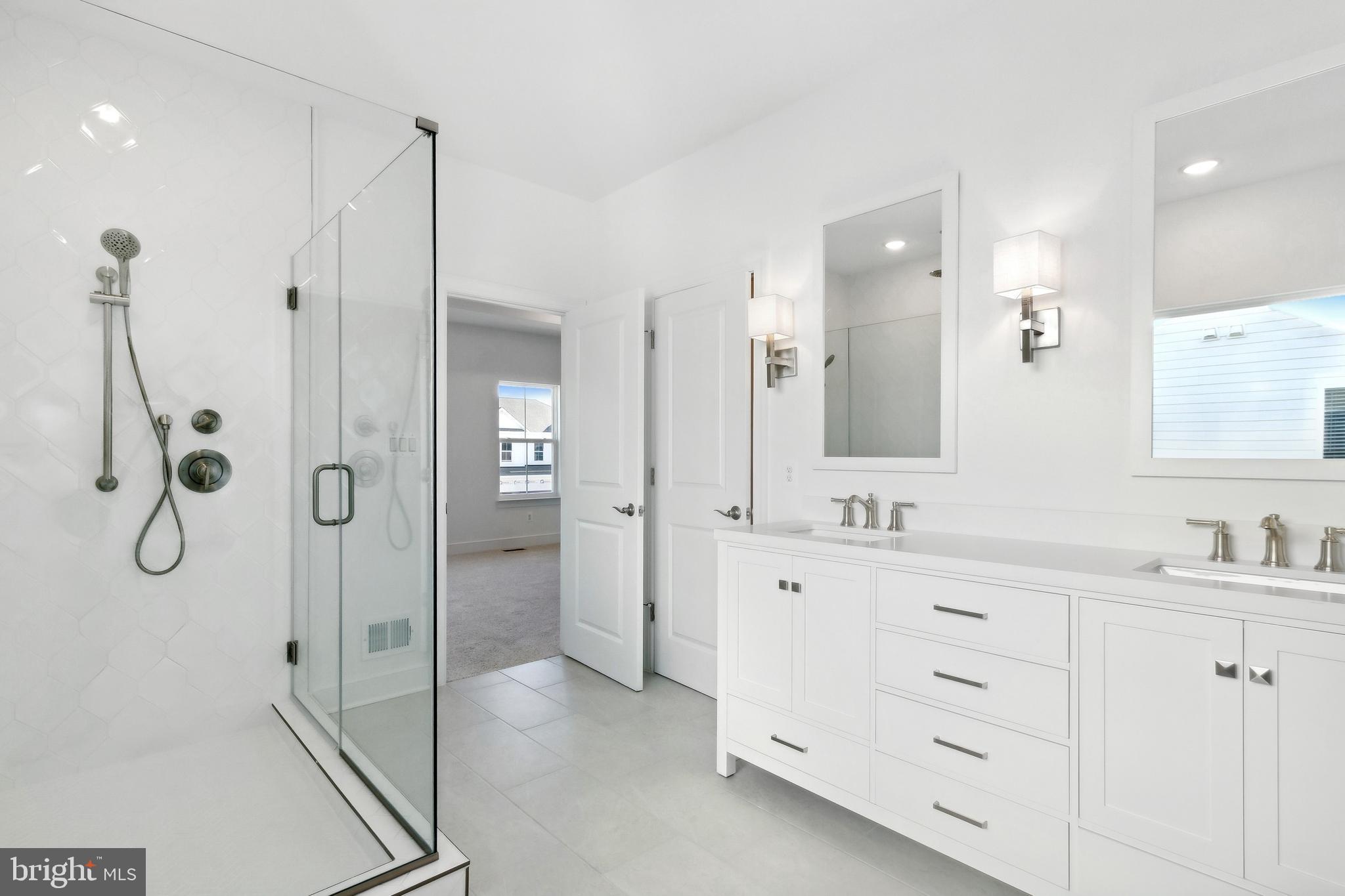 128 Patterson Court Middletown, DE 19709 - Photo 18 of 31 a bathroom with a shower sink and mirror