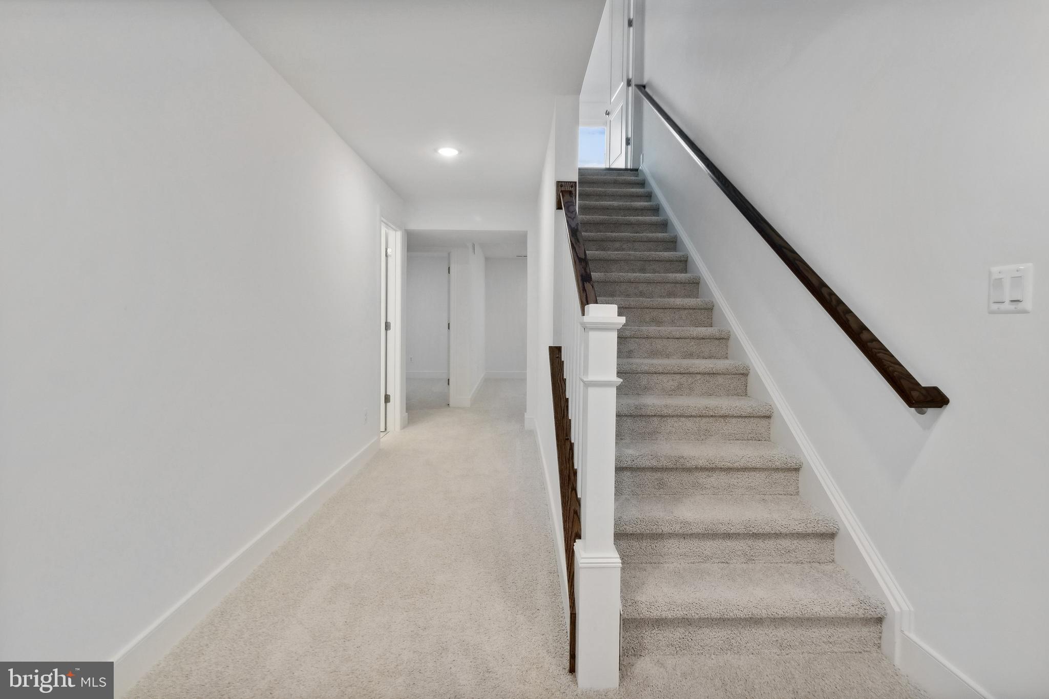 128 Patterson Court Middletown, DE 19709 - Photo 27 of 31 a view of staircase with wooden floor and white walls