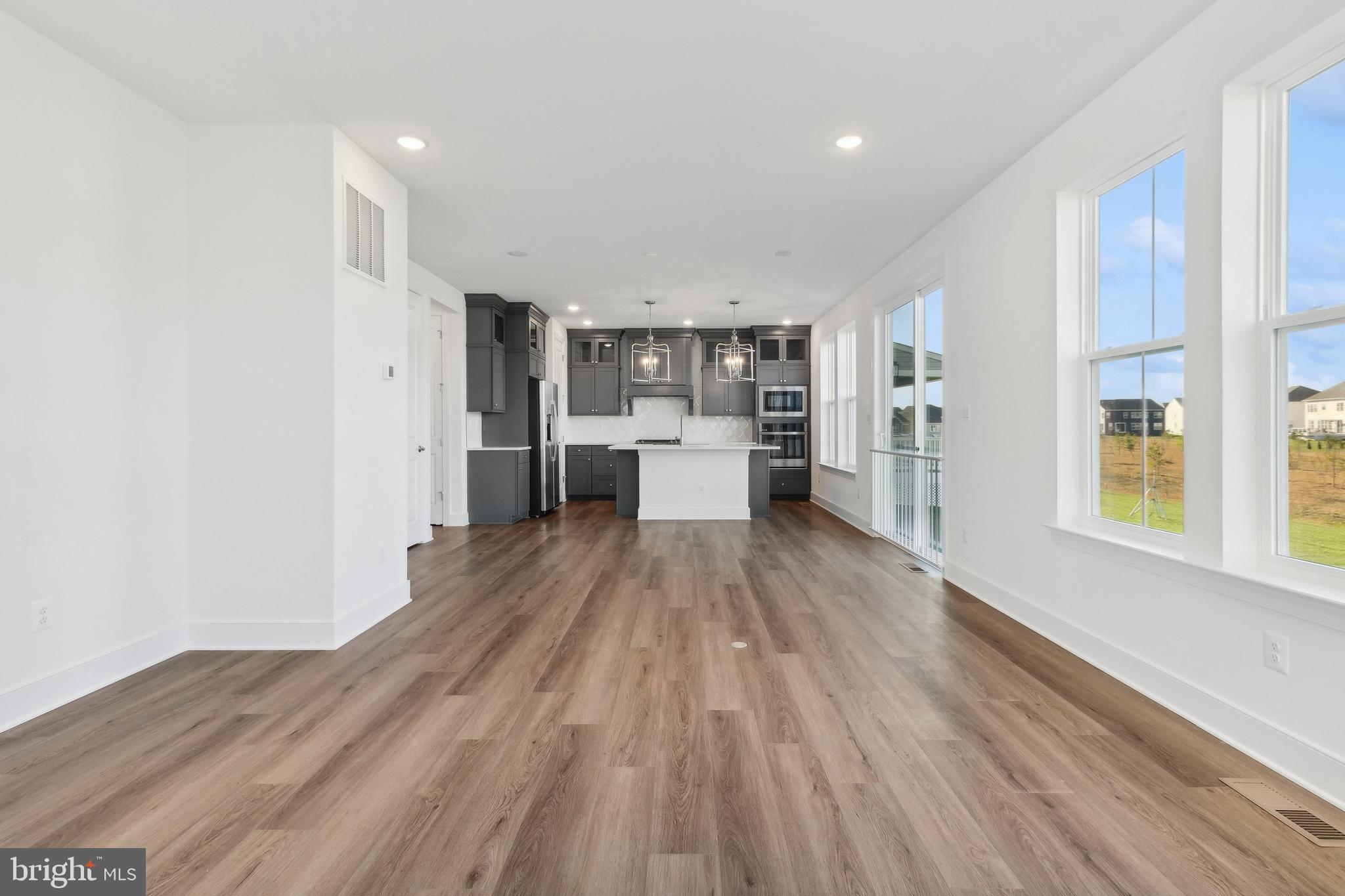128 Patterson Court Middletown, DE 19709 - Photo 6 of 31 a view of a kitchen with wooden floor