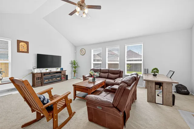 a living room with furniture and a window