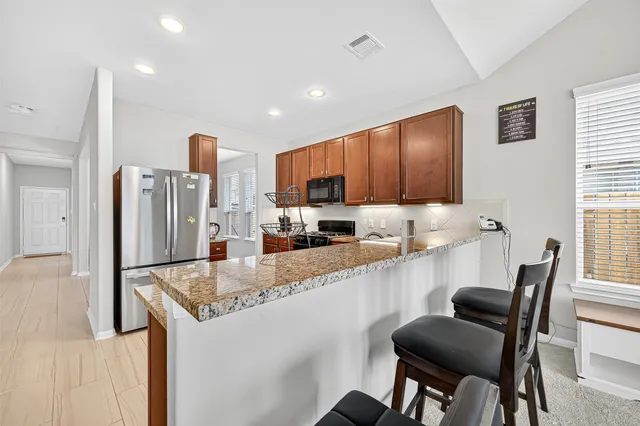 a bathroom with a sink mirror and toilet