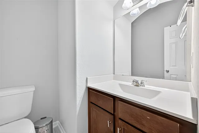 a living room with furniture a window and a flat screen tv