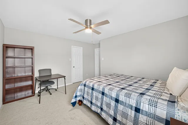 a view of a patio with a table chairs and a yard