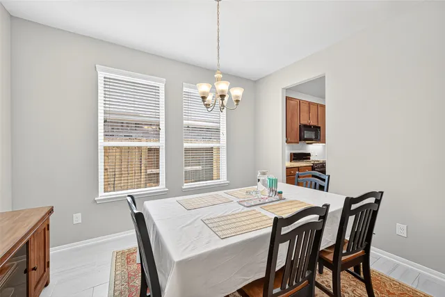 a bedroom with a bed and chandelier