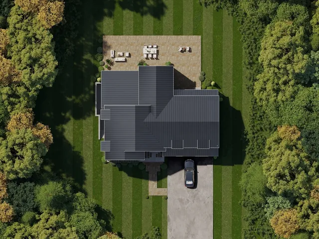 an aerial view of a house with a yard